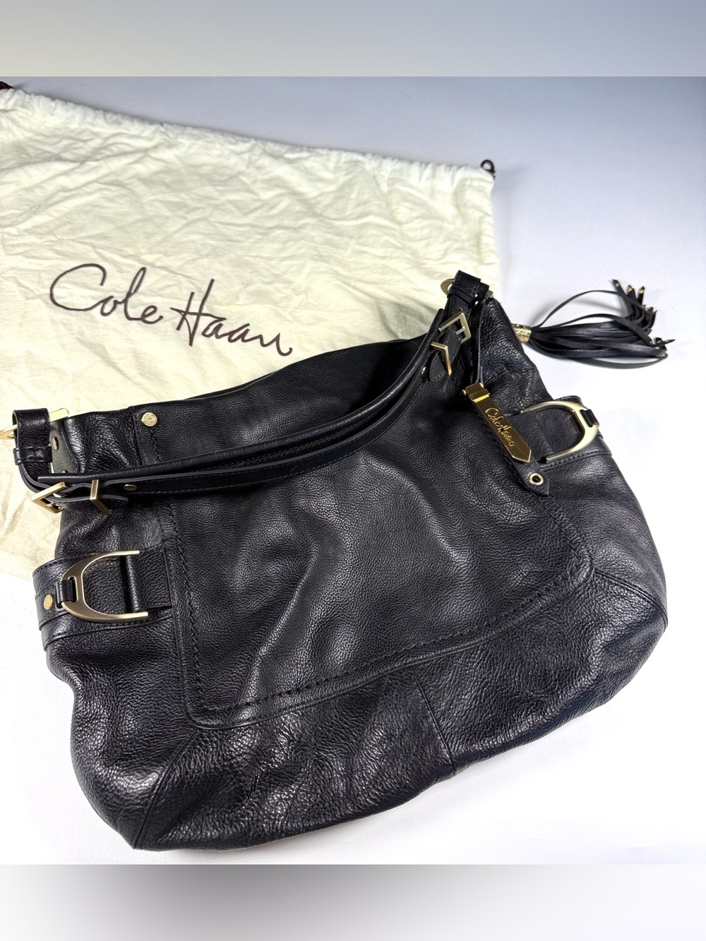 Cole Haan Black Leather Hobo Shoulder Bag with Tassel and Gold Accents